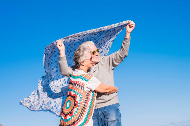 istock hippy aged couple at the beach 941485482