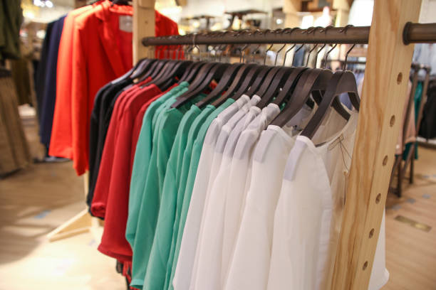 istock Colorful Sweaters on a Hangers in Store 941485784