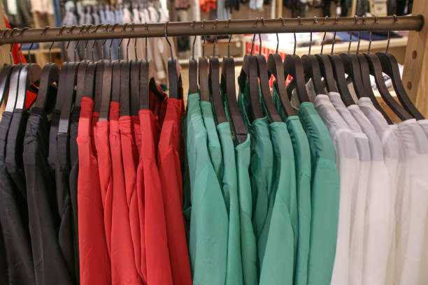istock Colorful Sweaters on a Hangers in Store 941485824