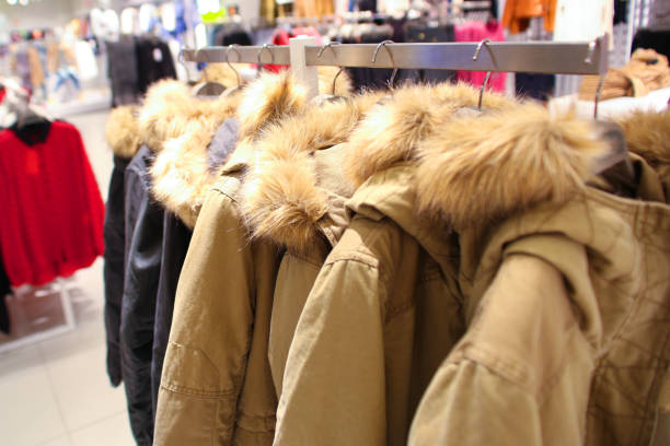 istock Winter Coats on a Hangers in Store 941488470