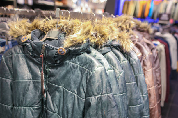 istock Winter Coats on a Hangers in Store 941488728
