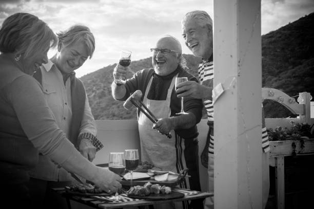 istock group of aged people doing barbecue 941491922