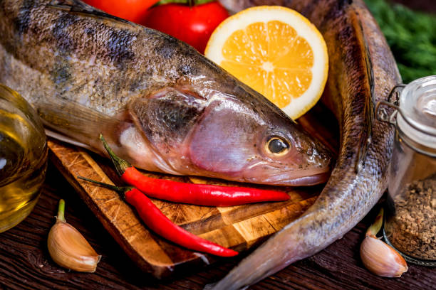istock Fresh zander wilt lemon, pepper and spices close 941495384