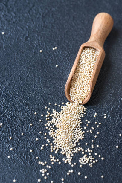 istock Scoop of raw quinoa 941495644
