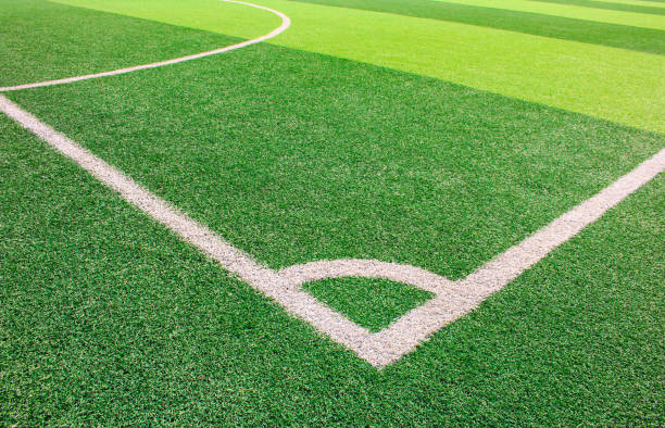 istock The white Line marking on the artificial green grass soccer field 941495774