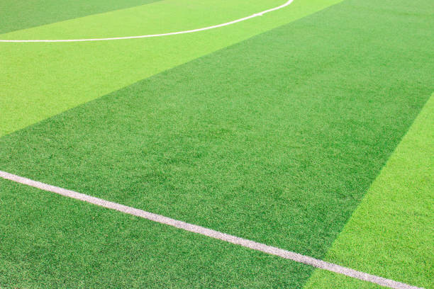 istock The white Line marking on the artificial green grass soccer field 941497048