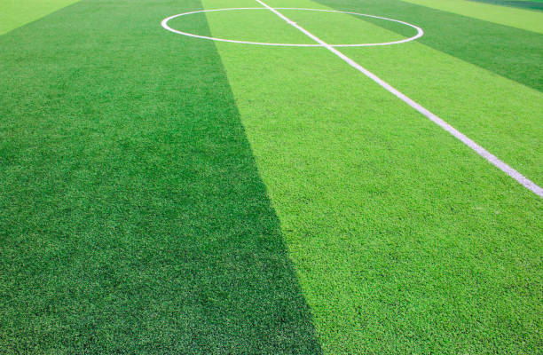 istock The white Line marking on the artificial green grass soccer field 941497082
