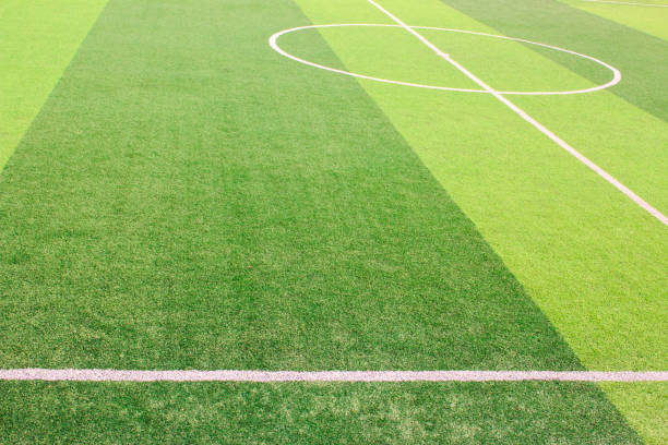 istock The white Line marking on the artificial green grass soccer field 941497362