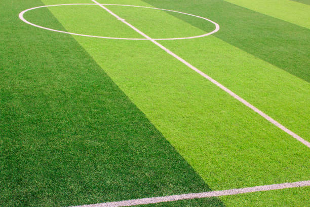 istock The white Line marking on the artificial green grass soccer field 941497428