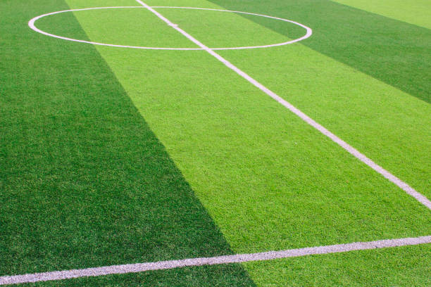 istock The white Line marking on the artificial green grass soccer field 941497542