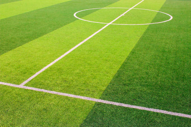 istock The white Line marking on the artificial green grass soccer field 941497852