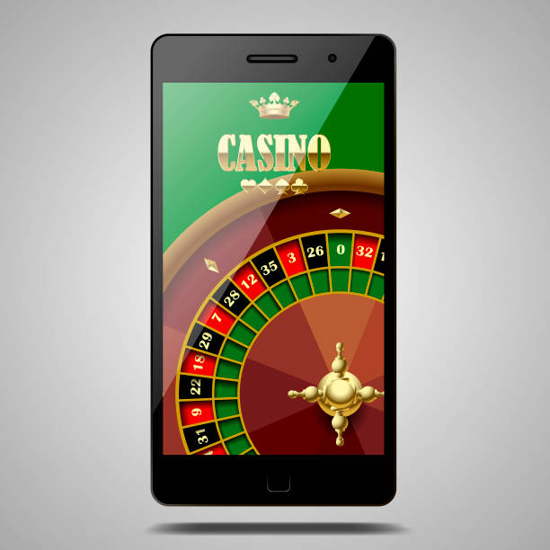 istock Modern phone isolated on white with Casino roulette wheel in the green screen 941498022