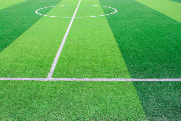 istock The white Line marking on the artificial green grass soccer field 941500814