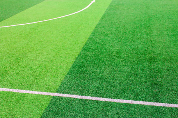 istock The white Line marking on the artificial green grass soccer field 941504158