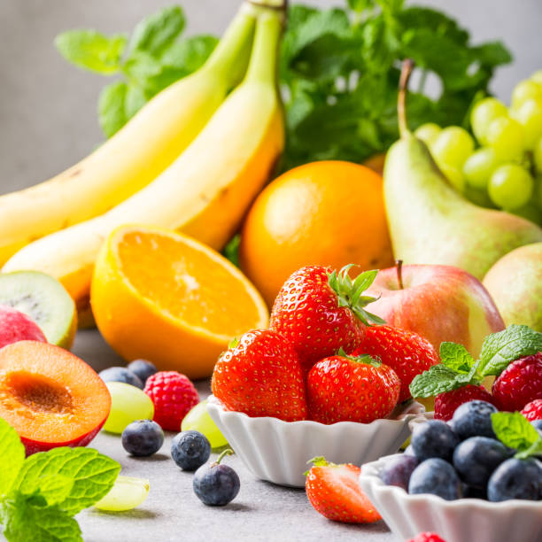istock Fresh assorted fruits and berries 941504684