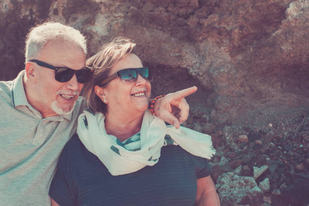 istock elderly couple happy under the sunlight 941504746
