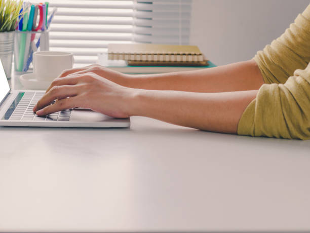 istock Close-up female hands touch on keyboard laptop, Working on her computer at office, Working from home. 941507464
