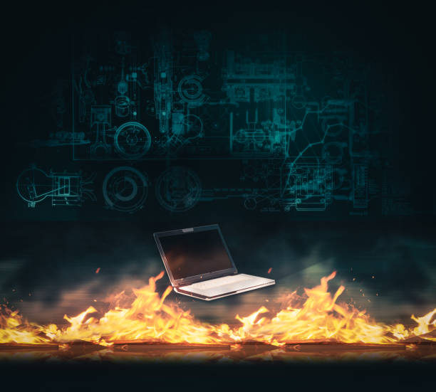 istock Laptop in front of a firewall suggesting cyber protection. 941511348
