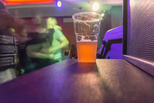 Photo of glass of beer in a rock club