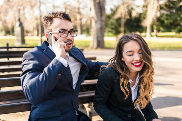 istock Office workers having fun in the park during lunch break 941511554