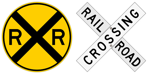 Vector illustration of two railroad crossing signs: a round sign and a crossbuck. Illustration uses no gradients, meshes or blends, only solid color. Includes AI10-compatible .eps format, and a high-res .jpg.