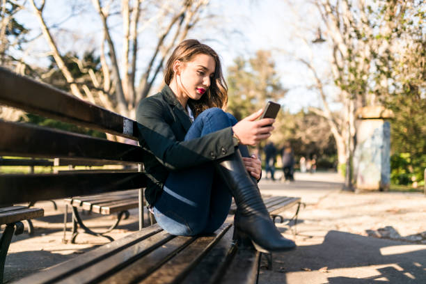 istock Beautiful Eastern European lady on a park bench 941512728