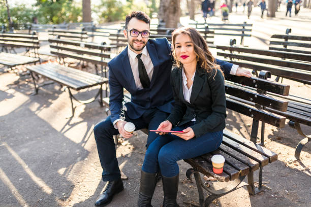 istock Young colleagues from Eastern Europe drinking coffee in park 941513494
