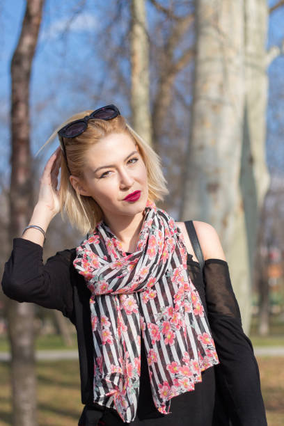 istock Beautiful blonde girl outside 941513694