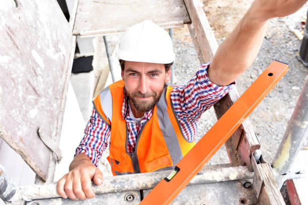 istock portrait smiling  construction manager / architect on site during the construction of a house - planning and control on site 941515150