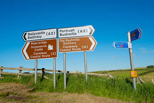 Road signs in Country Antrim point the directions to various towns and landmarks in this region of Northern Ireland.