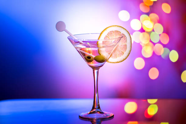 istock Stylish martini glass with bokeh background. 941523172