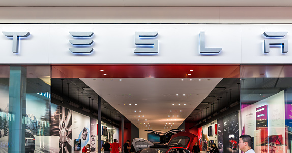 Mclean, USA - January 26, 2018: Tesla store exterior in indoor shopping mall in Tyson's Corner, Virginia for electric cars, sign closeup, Elon Musk's company