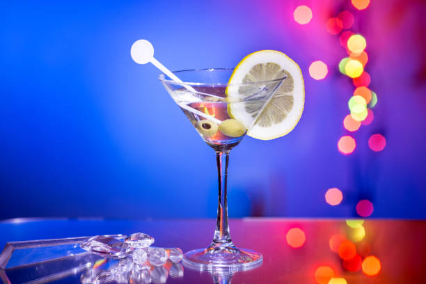 istock Stylish martini glass with bokeh background. 941523196