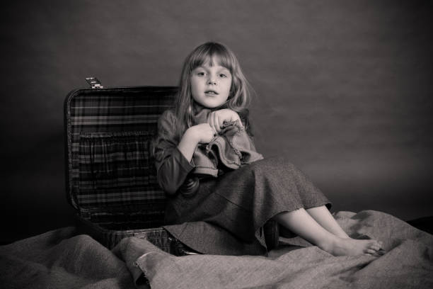 istock The girl and the suitcase. 941523608