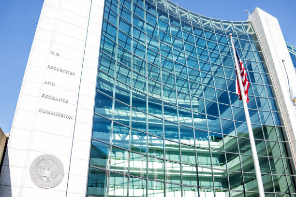 US United States Securities and Exchange Commission SEC entrance architecture modern building sign, logo, american flag, looking up sky, glass windows reflection Washington DC, USA - January 13, 2018: US United States Securities and Exchange Commission SEC entrance architecture modern building sign, logo, american flag, looking up sky, glass windows reflection exchanging photos stock pictures, royalty-free photos & images