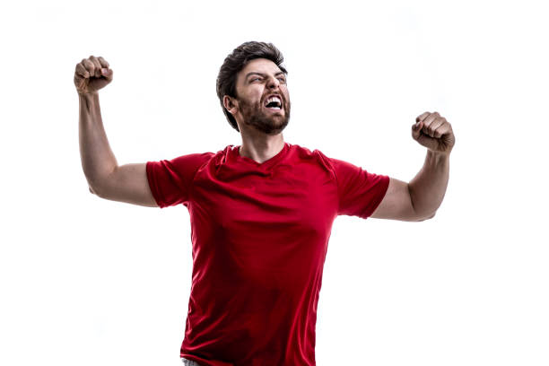 istock Fan / Sport Player on red uniform celebrating on white background 941526520