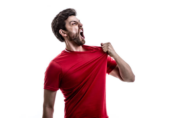 istock Fan / Sport Player on red uniform celebrating on white background 941526534
