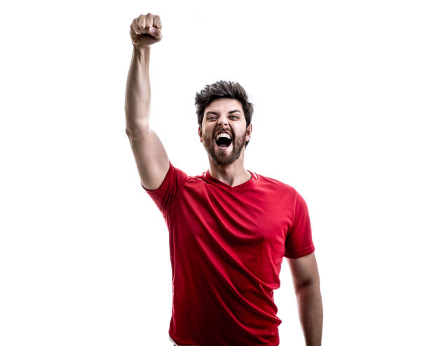 istock Fan / Sport Player on red uniform celebrating on white background 941526538