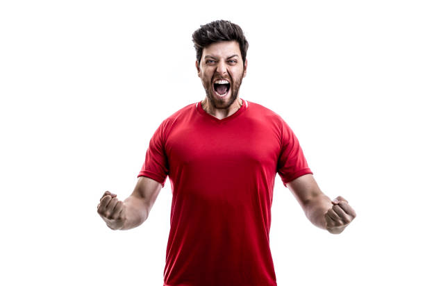 istock Fan / Sport Player on red uniform celebrating on white background 941526542