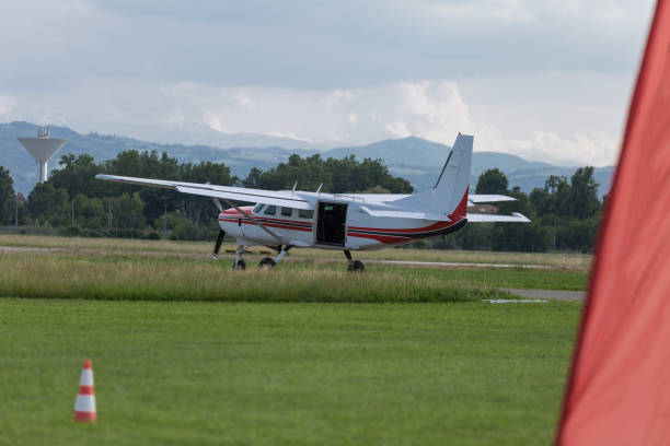 istock White Piper Aircraft with Open Tailgate and Parachutist inside: Parachuting Training 941535182