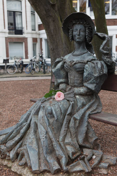 The Hague, Netherlands - January 3, 2017: Statue Lady On Bench on Anna Paulownastraat in the Hague. The statue was created in 1999 by Alexander Taratynov and depicting Anna Paulowna, Queen Anna of the Netherlands