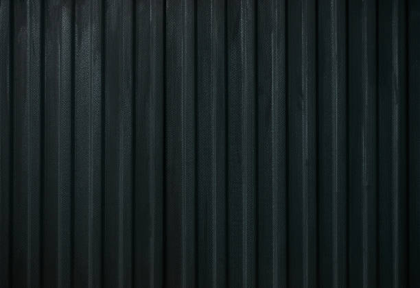 istock Black steel metallic hole texture background 941557674