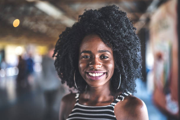 istock Afro young woman portrait 941562564