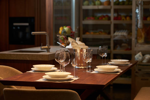 istock Modern kitchen interior with clean white plates, glasses and cut 941565726