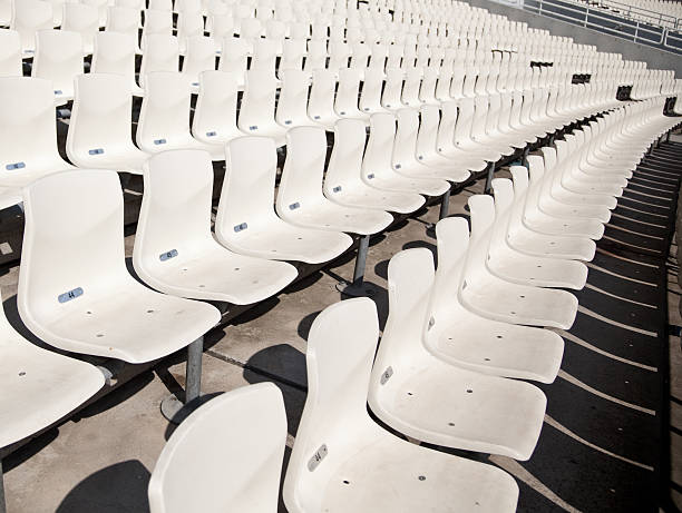 Several rows of empty seats in statium stock photo