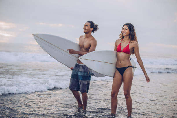 istock Young surfers at the beach 941566562