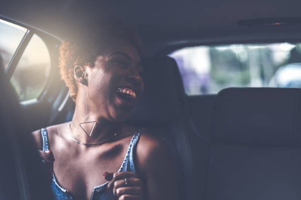 istock Afro girl inside a car 941567680