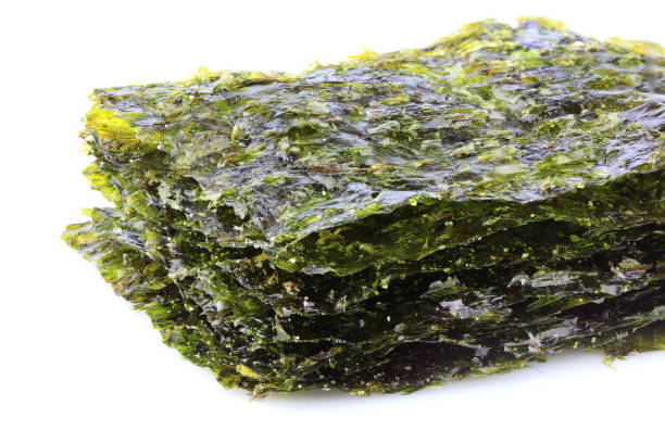 istock Crispy dried seaweed nori isolated. 941570006