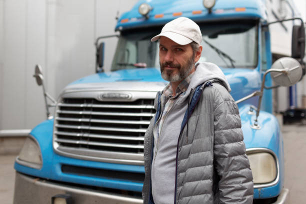 Mature bearded man against retro styled truck