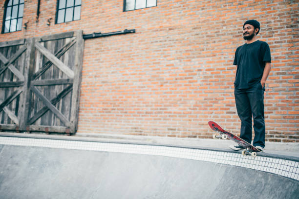 istock Skater man at skateboard park 941575392